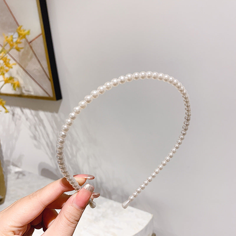 Thin pearl headband Image