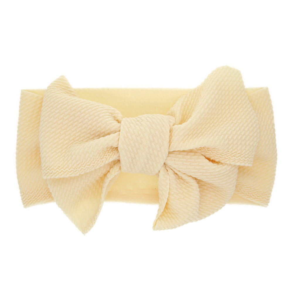 New-born baby's solid-colored bow headband Image