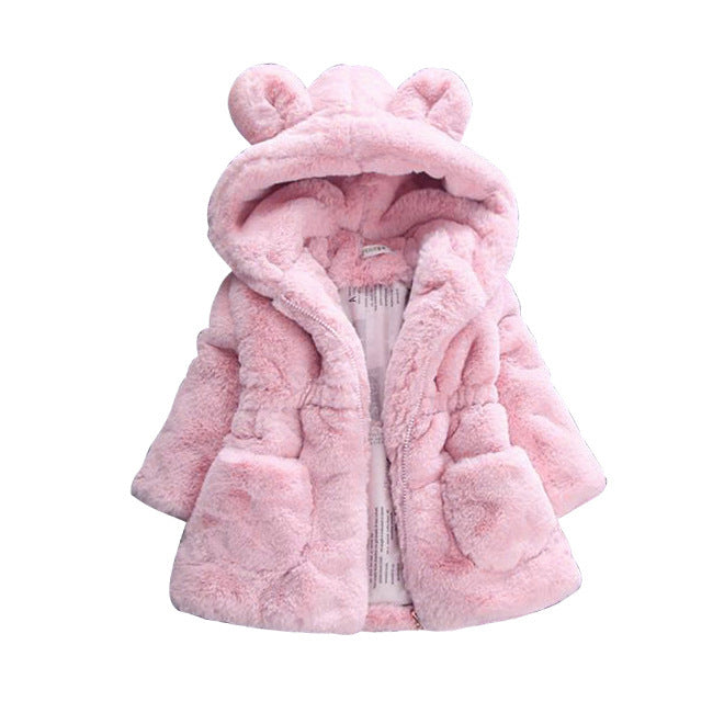 A girl's fur coat for autumn and winter Image