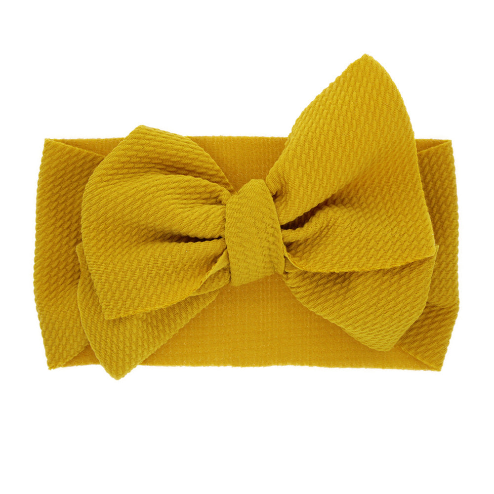 New-born baby's solid-colored bow headband Image