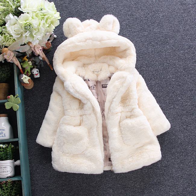 A girl's fur coat for autumn and winter Image