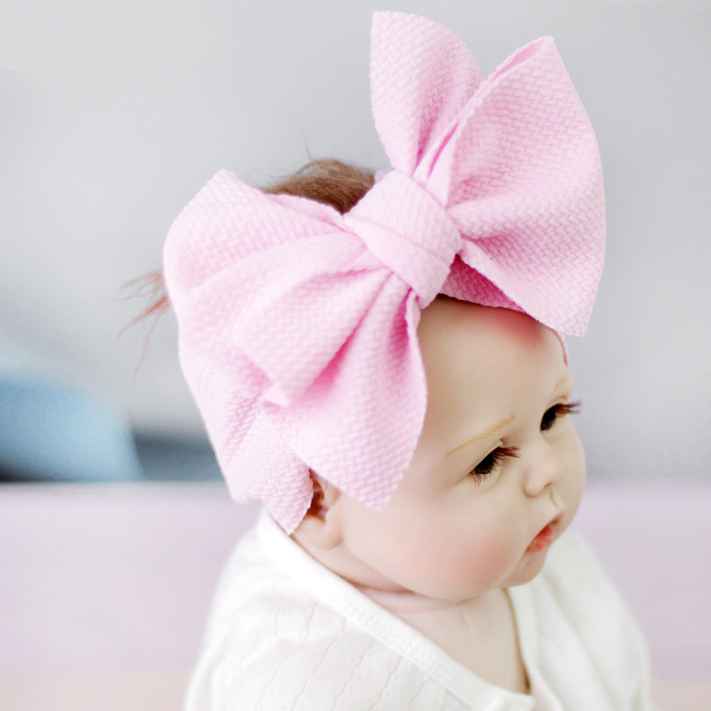 New-born baby's solid-colored bow headband Image