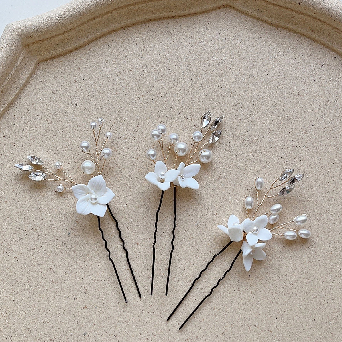 Three Sets Of White Flower U Shaped Hairpins Image