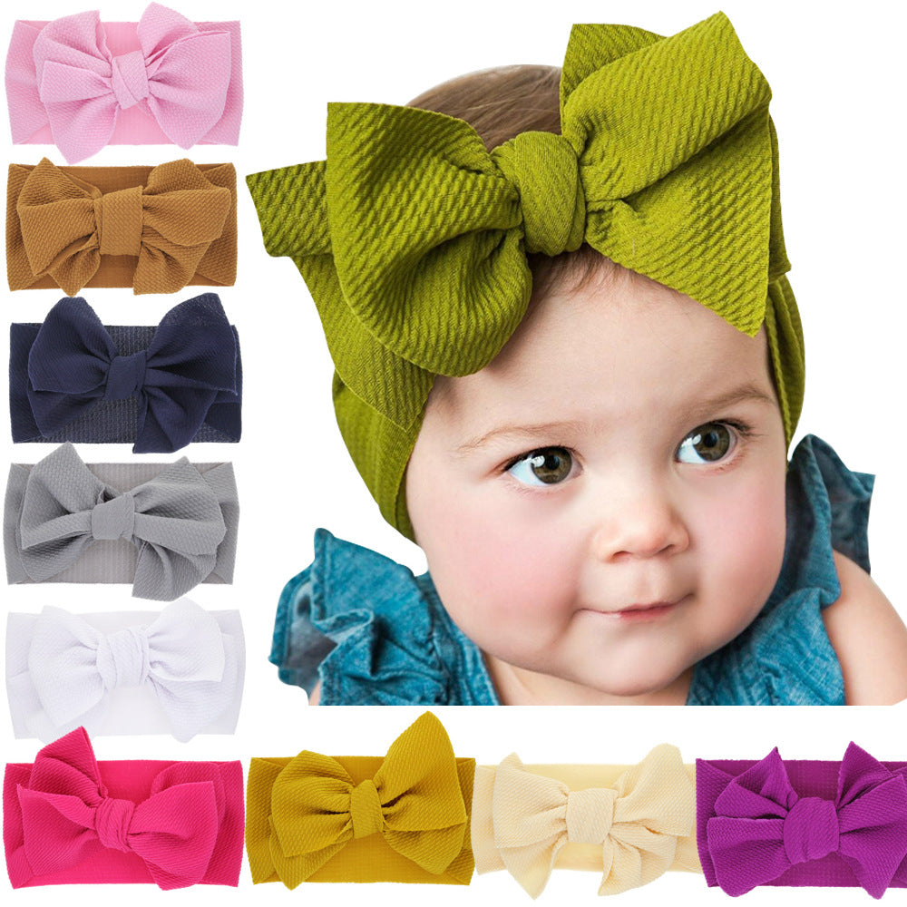 New-born baby's solid-colored bow headband Image