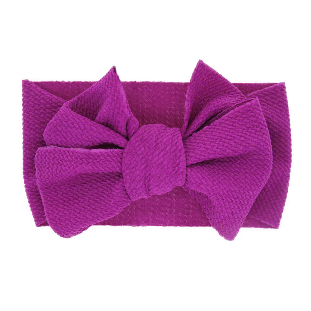 New-born baby's solid-colored bow headband Image