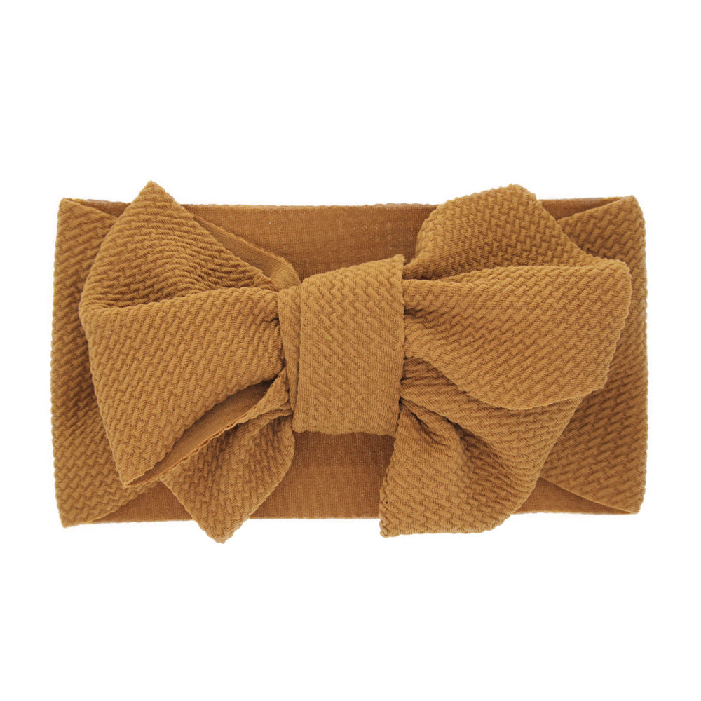 New-born baby's solid-colored bow headband Image