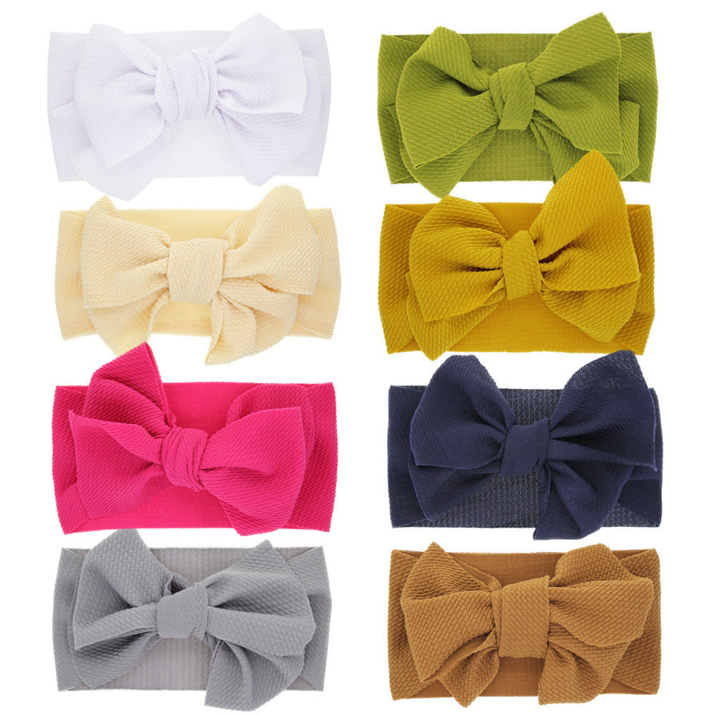 New-born baby's solid-colored bow headband Image