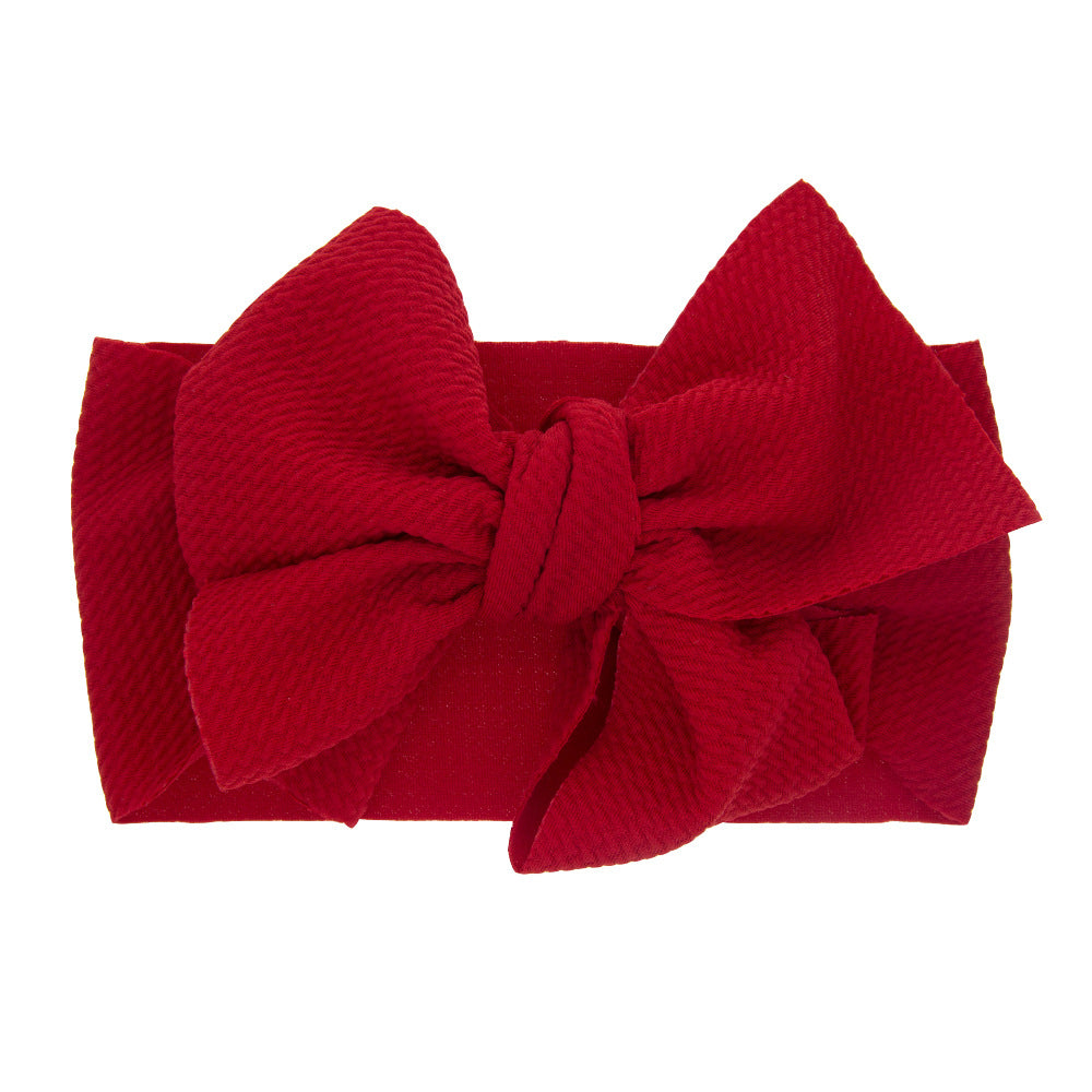 New-born baby's solid-colored bow headband Image