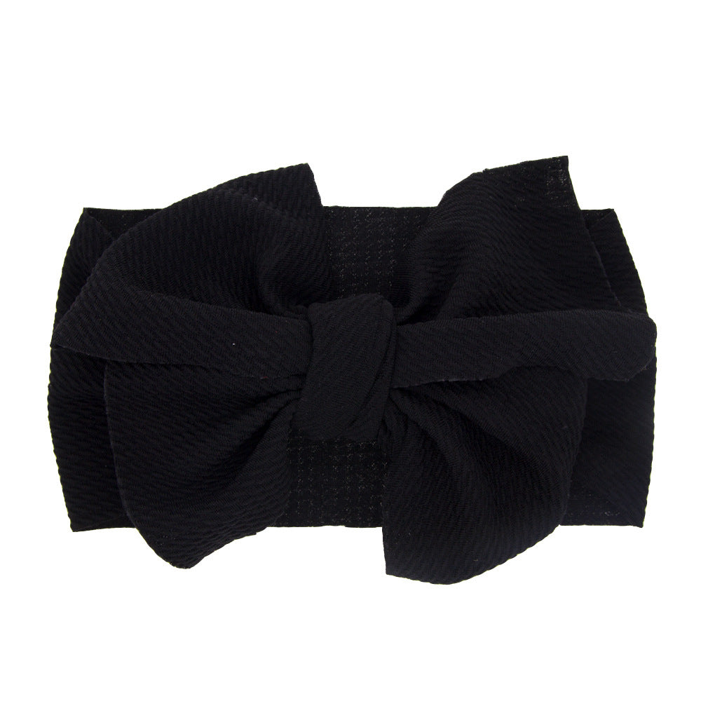 New-born baby's solid-colored bow headband Image