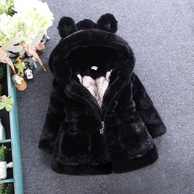 A girl's fur coat for autumn and winter Image