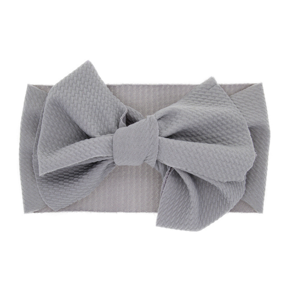 New-born baby's solid-colored bow headband Image