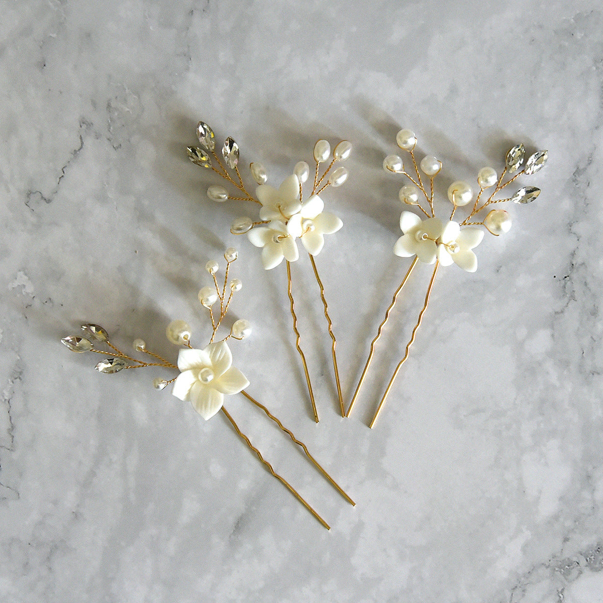 Three Sets Of White Flower U Shaped Hairpins Image