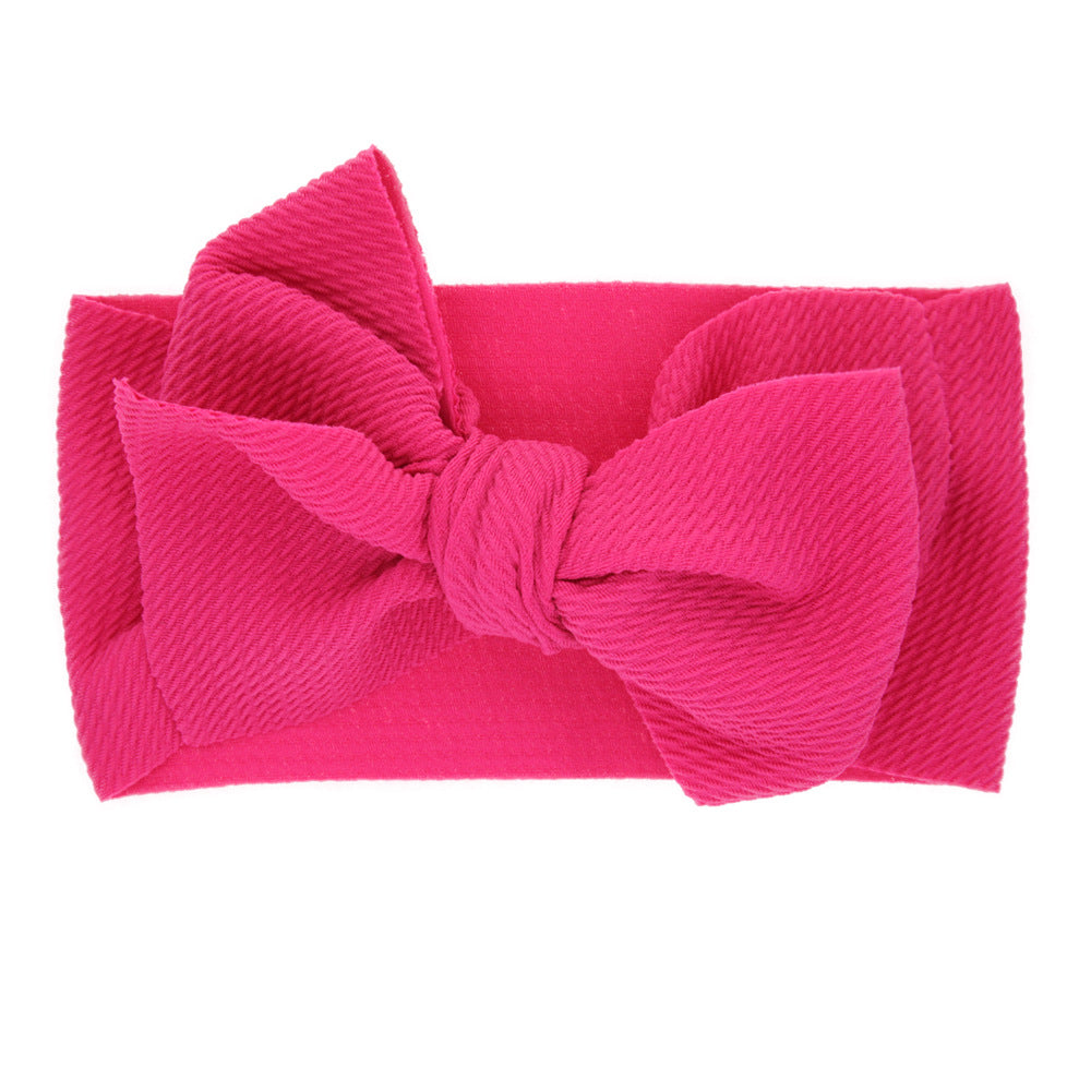 New-born baby's solid-colored bow headband Image