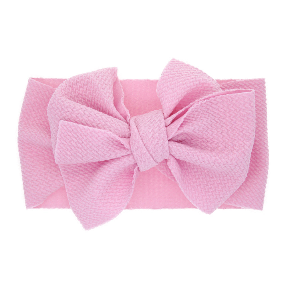 New-born baby's solid-colored bow headband Image