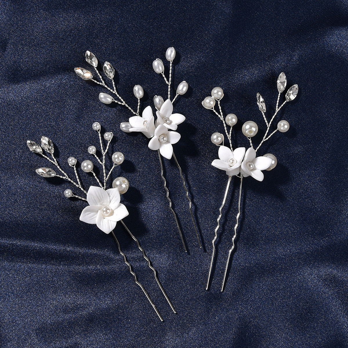 Three Sets Of White Flower U Shaped Hairpins Image