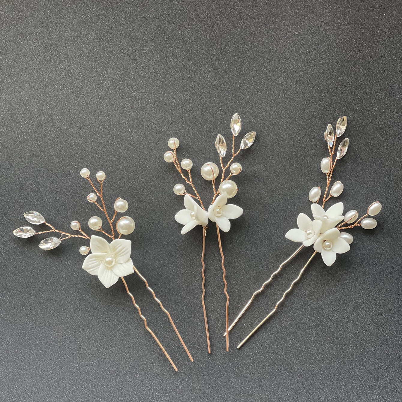 Three Sets Of White Flower U Shaped Hairpins Image